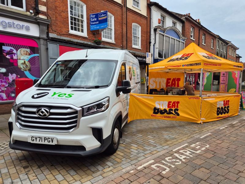 The yellow Streat Boss gazebo stall set up on a market street