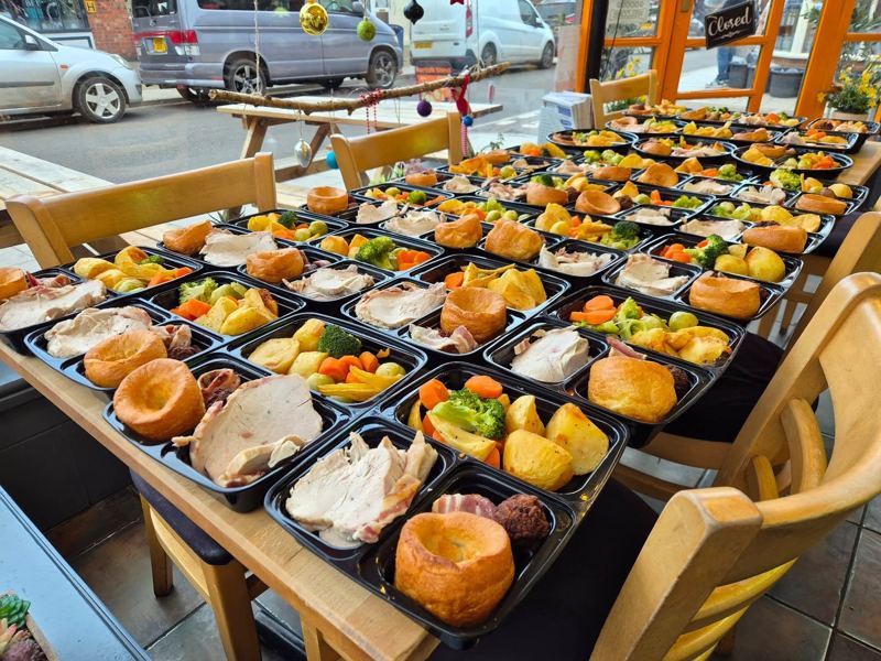 Rows of roast dinner boxes with turkey, Yorkshire puddings, roast potatoes and vegetables